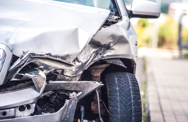 damaged automobiles after collision in city