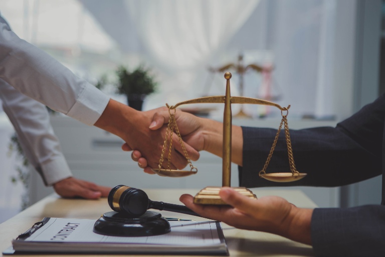 People shaking hands in a law office